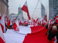 Participant carry flags while attending Independence March celebrating the 106 anniversary of Poland regaining independence. Warsaw, Poland...