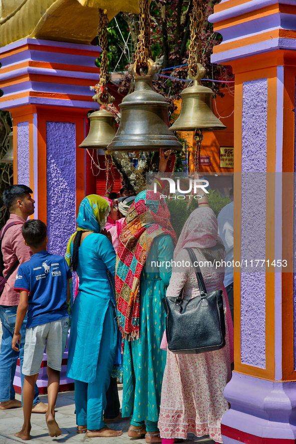 Hindu devotees ring bells while visiting the Maa Naina Devi Temple in Nainital, Uttarakhand, India, on April 21, 2024. Naina Devi Temple is...