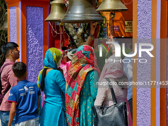 Hindu devotees ring bells while visiting the Maa Naina Devi Temple in Nainital, Uttarakhand, India, on April 21, 2024. Naina Devi Temple is...