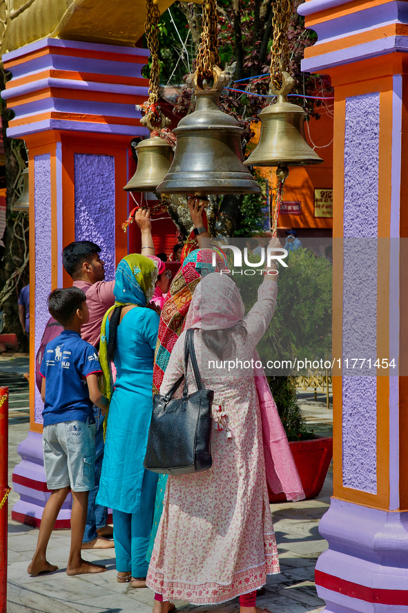 Hindu devotees ring bells while visiting the Maa Naina Devi Temple in Nainital, Uttarakhand, India, on April 21, 2024. Naina Devi Temple is...