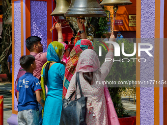 Hindu devotees ring bells while visiting the Maa Naina Devi Temple in Nainital, Uttarakhand, India, on April 21, 2024. Naina Devi Temple is...