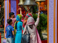 Hindu devotees ring bells while visiting the Maa Naina Devi Temple in Nainital, Uttarakhand, India, on April 21, 2024. Naina Devi Temple is...