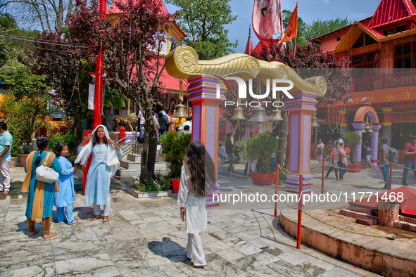 Hindu devotees visit the Maa Naina Devi Temple in Nainital, Uttarakhand, India, on April 21, 2024. Naina Devi Temple is a famous Indian pilg...