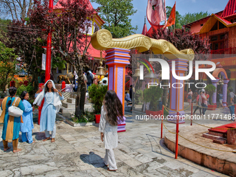 Hindu devotees visit the Maa Naina Devi Temple in Nainital, Uttarakhand, India, on April 21, 2024. Naina Devi Temple is a famous Indian pilg...