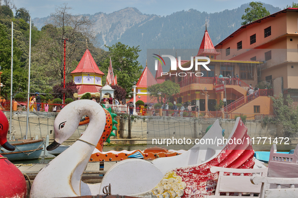 Swan-shaped paddle boats are seen along Naini Lake by the Maa Naina Devi Temple in Nainital, Uttarakhand, India, on April 21, 2024. Naina De...