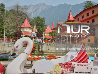 Swan-shaped paddle boats are seen along Naini Lake by the Maa Naina Devi Temple in Nainital, Uttarakhand, India, on April 21, 2024. Naina De...