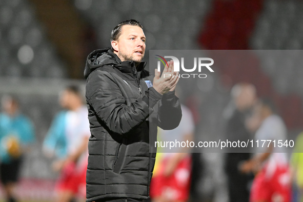 Manager Mark Bonner, the manager of Gillingham, applauds fans after the final whistle during the EFL Trophy match between Stevenage and Gill...