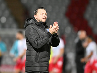 Manager Mark Bonner, the manager of Gillingham, applauds fans after the final whistle during the EFL Trophy match between Stevenage and Gill...