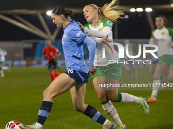 Lily Murphy, number 46 of Manchester City W.F.C., is tackled by an opponent during the UEFA Champions League Group D match between Mancheste...