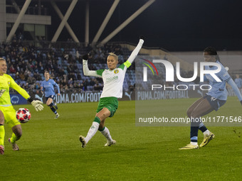 Khadija Shaw #21 of Manchester City W.F.C. takes a shot at goal during the UEFA Champions League Group D match between Manchester City and H...