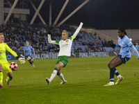 Khadija Shaw #21 of Manchester City W.F.C. takes a shot at goal during the UEFA Champions League Group D match between Manchester City and H...