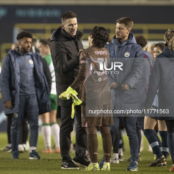 Aoba Fujino #20 of Manchester City W.F.C. shakes hands with Ayaka Yamashita #31 (GK) of Manchester City W.F.C. at full time during the UEFA...