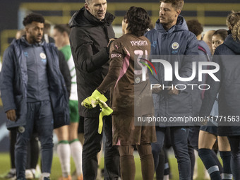 Aoba Fujino #20 of Manchester City W.F.C. shakes hands with Ayaka Yamashita #31 (GK) of Manchester City W.F.C. at full time during the UEFA...