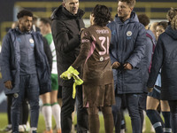 Aoba Fujino #20 of Manchester City W.F.C. shakes hands with Ayaka Yamashita #31 (GK) of Manchester City W.F.C. at full time during the UEFA...