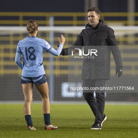 Manchester City W.F.C. manager Gareth Taylor shakes hands with Kerstin Casparij #18 of Manchester City W.F.C. at full time during the UEFA C...