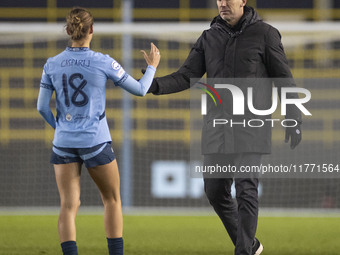 Manchester City W.F.C. manager Gareth Taylor shakes hands with Kerstin Casparij #18 of Manchester City W.F.C. at full time during the UEFA C...