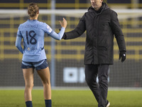 Manchester City W.F.C. manager Gareth Taylor shakes hands with Kerstin Casparij #18 of Manchester City W.F.C. at full time during the UEFA C...