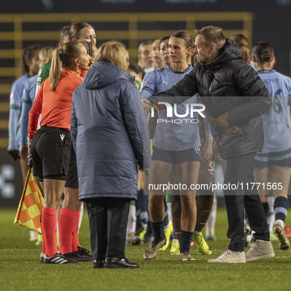 Hammarby IF manager Martin Sjogren shakes hands with Referee Frida Nielsen at full time during the UEFA Champions League Group D match betwe...