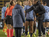 Hammarby IF manager Martin Sjogren shakes hands with Referee Frida Nielsen at full time during the UEFA Champions League Group D match betwe...