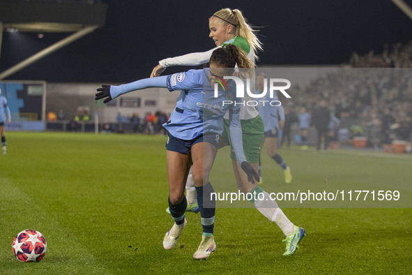 Mary Fowler #8 of Manchester City W.F.C. is challenged by the opponent during the UEFA Champions League Group D match between Manchester Cit...