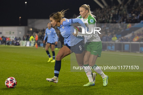 Mary Fowler #8 of Manchester City W.F.C. is challenged by the opponent during the UEFA Champions League Group D match between Manchester Cit...