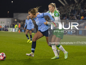 Mary Fowler #8 of Manchester City W.F.C. is challenged by the opponent during the UEFA Champions League Group D match between Manchester Cit...