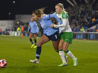 Mary Fowler #8 of Manchester City W.F.C. is challenged by the opponent during the UEFA Champions League Group D match between Manchester Cit...