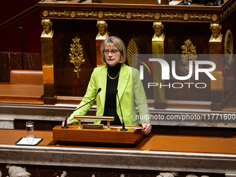 Veronique Louwagie, deputy of the Droite Republicaine group, stands before speaking during the public session of the solemn vote on the firs...