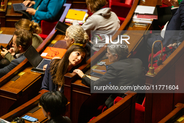 Sandrina Rousseau (R) and Marie-Charlotte Garin (L), MPs deputies of the Ecologiste et Social group, are seen during the public session of t...