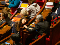 Sandrina Rousseau (R) and Marie-Charlotte Garin (L), MPs deputies of the Ecologiste et Social group, are seen during the public session of t...