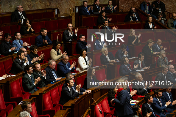 Deputies of the far-right group Rassemblement National are seen during the public session of the solemn vote on the first part of the financ...