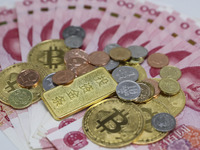 A photo taken in Huaian, China, on November 13, 2024, shows bitcoin and the Chinese yuan. (