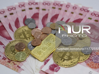 A photo taken in Huaian, China, on November 13, 2024, shows bitcoin and the Chinese yuan. (