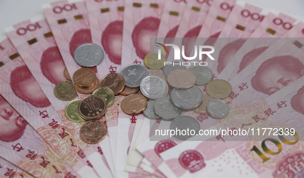 A photo taken in Huaian, China, on November 13, 2024, shows bitcoin and the Chinese yuan. 