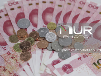 A photo taken in Huaian, China, on November 13, 2024, shows bitcoin and the Chinese yuan. (