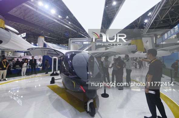 Visitors view AEROFUGIA's tilt-rotor unmanned manned aircraft at the 2024 Zhuhai Air Show in Zhuhai, China, on November 13, 2024. 