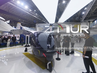 Visitors view AEROFUGIA's tilt-rotor unmanned manned aircraft at the 2024 Zhuhai Air Show in Zhuhai, China, on November 13, 2024. (