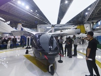 Visitors view AEROFUGIA's tilt-rotor unmanned manned aircraft at the 2024 Zhuhai Air Show in Zhuhai, China, on November 13, 2024. (