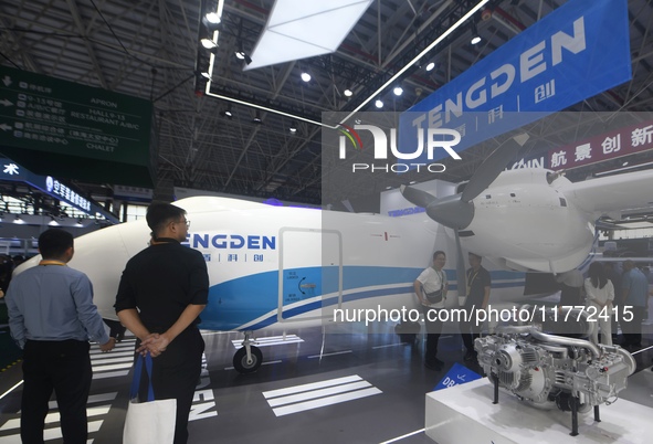 Visitors view Tengden's large unmanned cargo aircraft at the 2024 Zhuhai Airshow in Zhuhai, China, on November 13, 2024. 