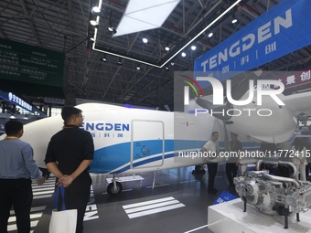 Visitors view Tengden's large unmanned cargo aircraft at the 2024 Zhuhai Airshow in Zhuhai, China, on November 13, 2024. (