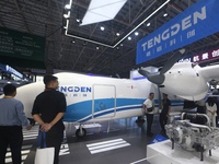 Visitors view Tengden's large unmanned cargo aircraft at the 2024 Zhuhai Airshow in Zhuhai, China, on November 13, 2024. (