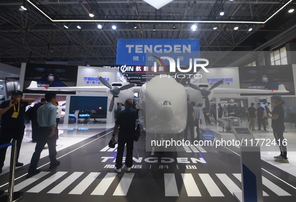 Visitors view Tengden's large unmanned cargo aircraft at the 2024 Zhuhai Airshow in Zhuhai, China, on November 13, 2024. 