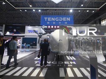 Visitors view Tengden's large unmanned cargo aircraft at the 2024 Zhuhai Airshow in Zhuhai, China, on November 13, 2024. (