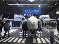 Visitors view Tengden's large unmanned cargo aircraft at the 2024 Zhuhai Airshow in Zhuhai, China, on November 13, 2024. (