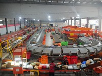 Workers of a courier company sort packages on a smart express line in Enshi, Hubei province, China, on November 13, 2024. (