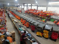 Workers of a courier company sort packages on a smart express line in Enshi, Hubei province, China, on November 13, 2024. (