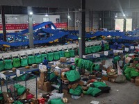 Workers of a courier company sort packages on a smart express line in Enshi, Hubei province, China, on November 13, 2024. (