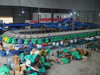 Workers of a courier company sort packages on a smart express line in Enshi, Hubei province, China, on November 13, 2024. (