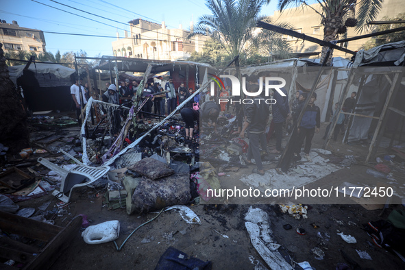 Displaced Palestinians check the damage following an Israeli strike that hits tents in Deir el-Balah in the central Gaza Strip on November 1...