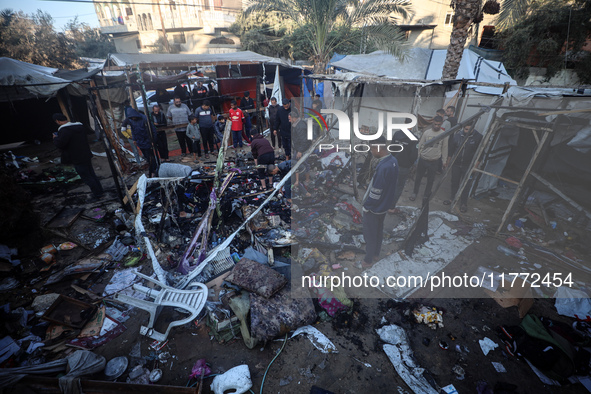 Displaced Palestinians check the damage following an Israeli strike that hits tents in Deir el-Balah in the central Gaza Strip on November 1...